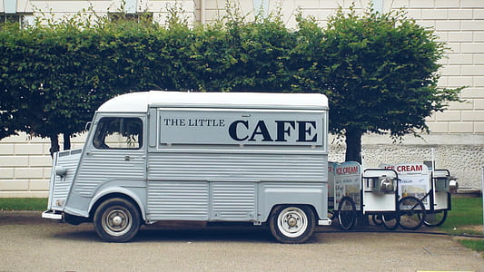 gray The Little Cafe bus park near trees thumbnail