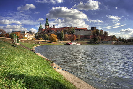 gray concrete castle beside body of water thumbnail