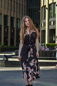 woman wearing black and brown bird print sleeveless dress thumbnail