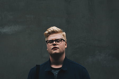 man wearing black top and eyeglasses thumbnail