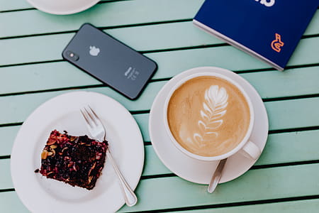 Drinking coffee and eating cake in a cafeteria thumbnail