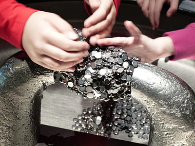 person holding gray coins thumbnail
