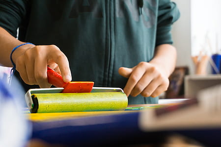 person holding rolling paint thumbnail