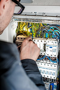 men fixing circuit board in control board thumbnail