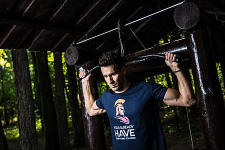 man wearing blue crew-neck t-shirt doing execise thumbnail