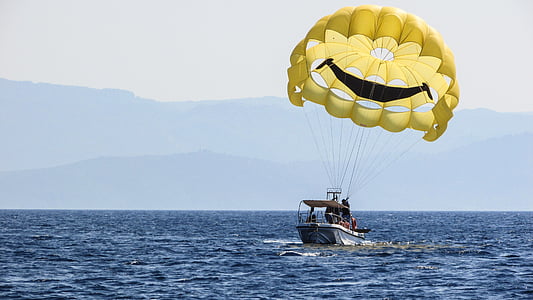 white motorboat on water during daytime thumbnail