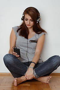 Beautiful young woman in headphones listening to music thumbnail