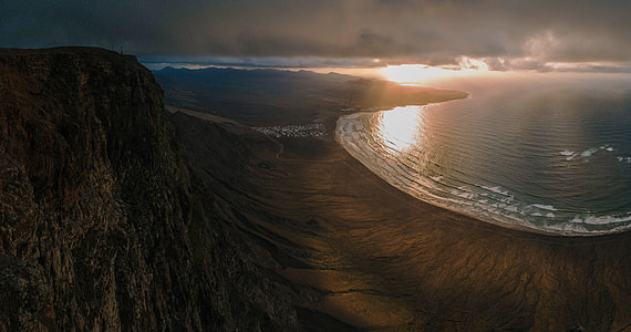 birds eye view of shore and body of water thumbnail