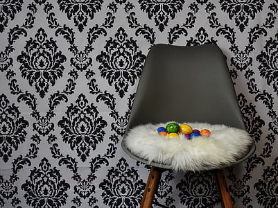 assorted egg decors on gray chair thumbnail