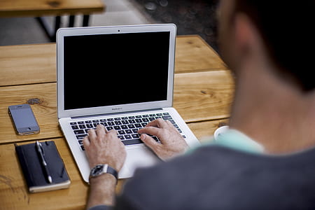 turn-on laptop computer on table thumbnail