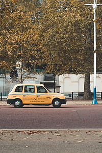 Yellow 5-door Hatchback Parked Near Trees thumbnail