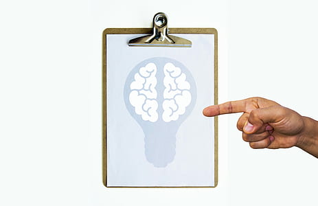 person's hand pointing on white brain illustration thumbnail