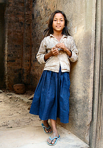 woman leaning on gray concrete wall thumbnail