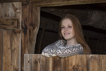 woman in white and black long-sleeved top inside stable thumbnail