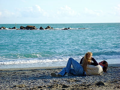 couple laying on beach side photography thumbnail