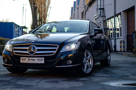 black Mercedes-Benz C-class on road near building thumbnail