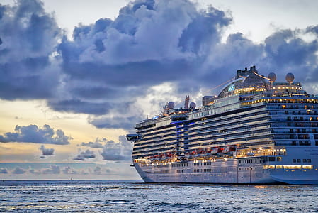 cruise ship on water during night time thumbnail