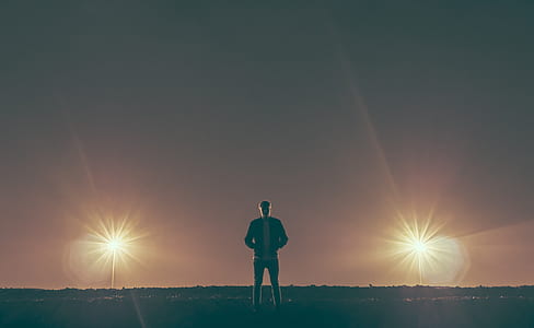 man standing near lights thumbnail