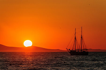 silhouette of boat during sunset thumbnail