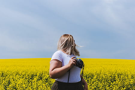 woman holding bridge camera thumbnail