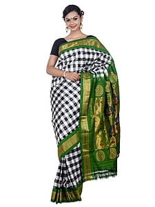 woman wearing white, black, and green sari dress thumbnail