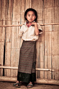 girl standing on bamboo house thumbnail