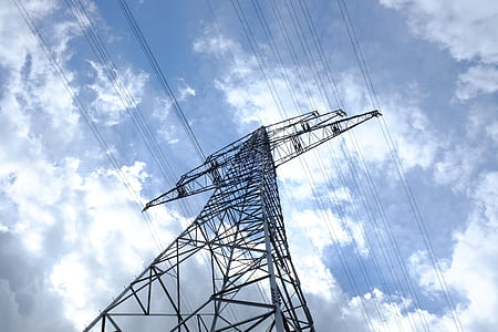 low-angle photo of electric post during partly cloudy day thumbnail