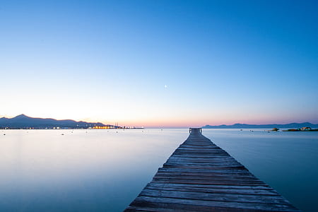gray wooden dock on body of water thumbnail