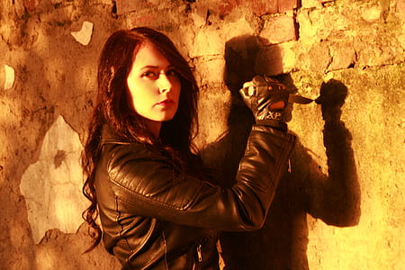 woman in leather jacket holding knife thumbnail