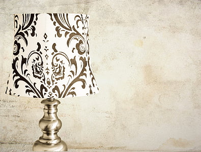 brown and white floral table lamp on beige surface thumbnail
