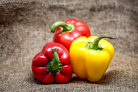 three red and yellow bell peppers thumbnail