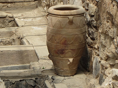 gray clay pot beside the wall thumbnail