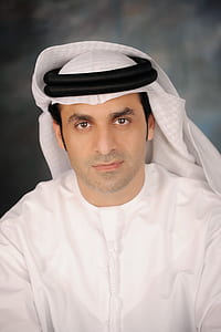 close-up photo of man wearing white shirt thumbnail