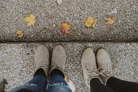 two person wearing gray leather boots thumbnail