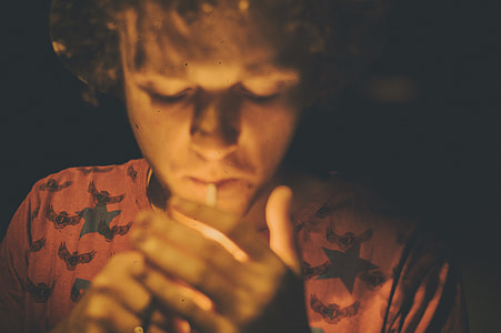 man lights cigarettes thumbnail