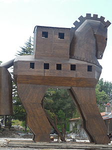 brown wooden horse statue during daytime thumbnail