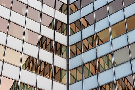 low-angle photography of glass wall building thumbnail