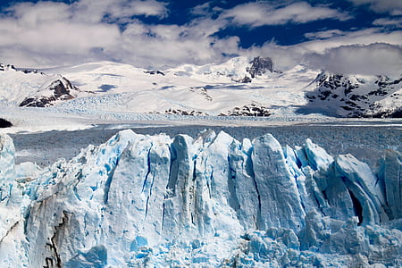 glacier near body of water thumbnail