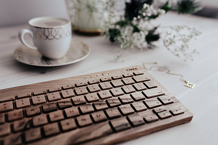 Wooden keyboard and cup of coffee thumbnail