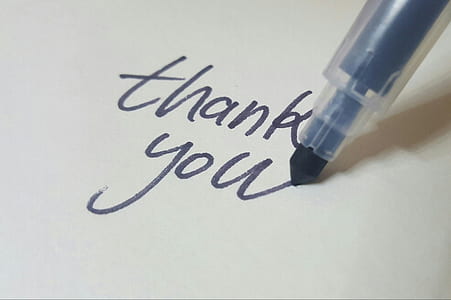 black pen writing thank you thumbnail