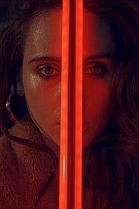 woman holding red LED weapon thumbnail