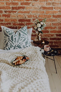 A lovely woman's bedroom with a beautiful bouquet of flowers thumbnail