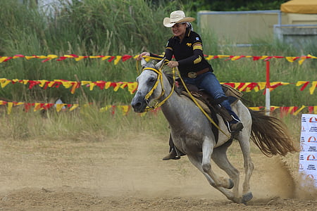 man rides gray horse thumbnail