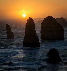 stone pillars on body of water thumbnail