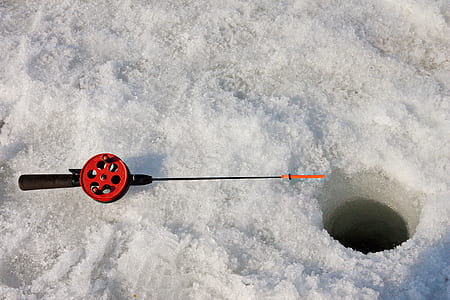 red and black fishing rod on snow thumbnail
