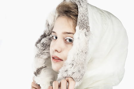closeup photo of woman wearing parka thumbnail