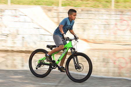 boy riding hardtail bicycle outdoors by day thumbnail