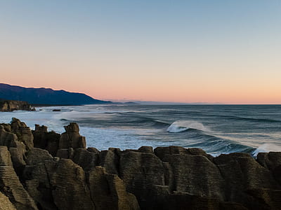 body of water surrounded of rock thumbnail