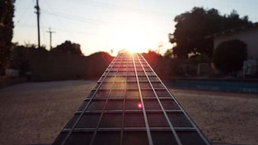 brown wooden guitar fret board thumbnail