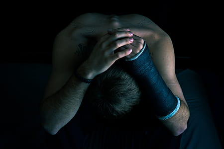 person wearing arm cask on left arm thumbnail
